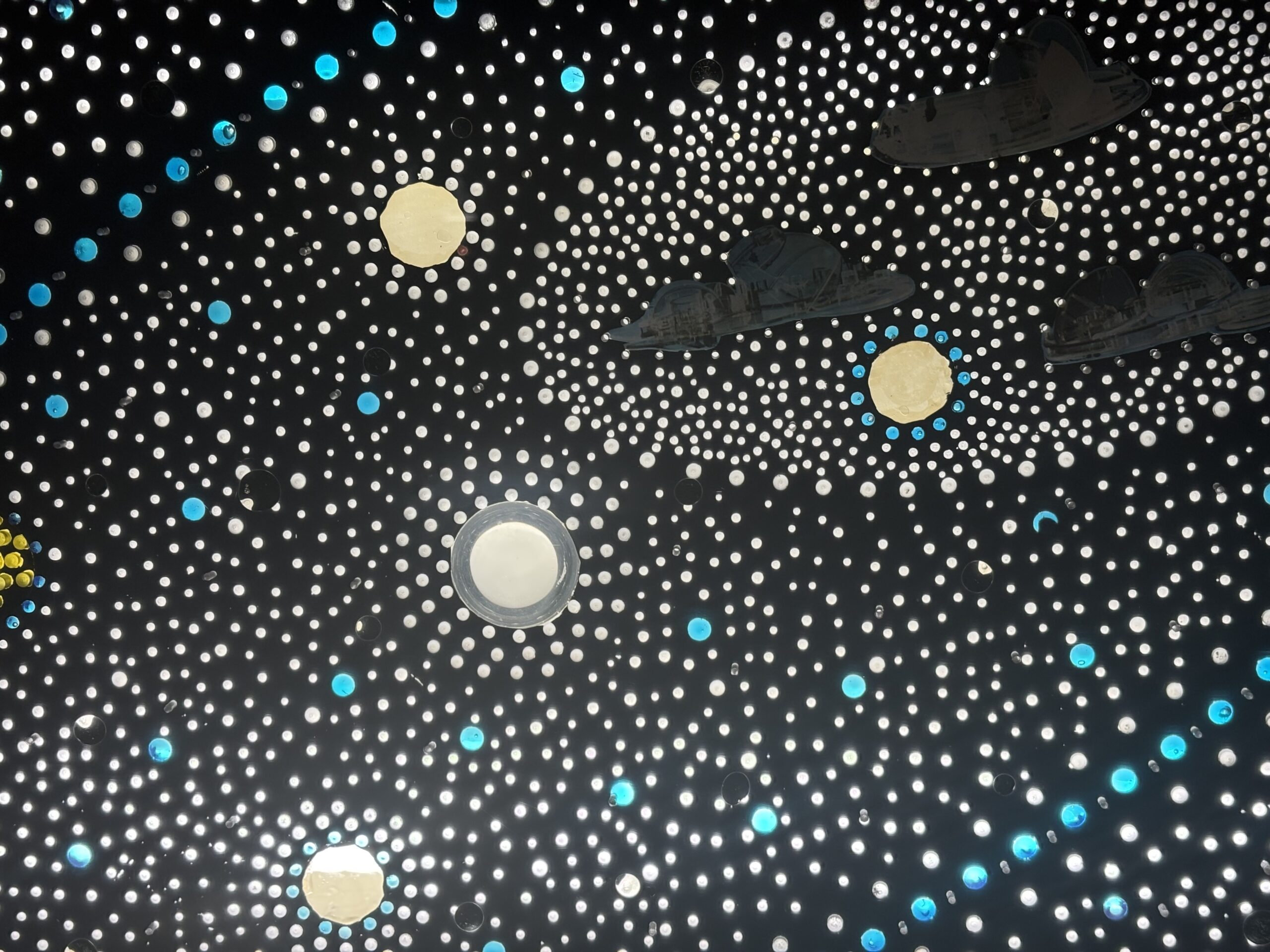 an artwork depicting a field of stars against a black background